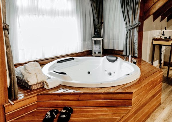 How can you create a home spa experience in a small bathroom?